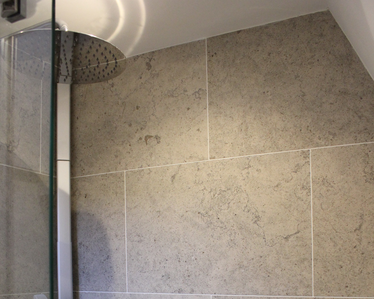 Stone for seamless shower