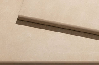 Close-up of natural stone tiles with a focus on texture and colour.