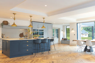 a large kitchen with a beautiful herringbone oak floor