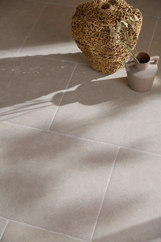 grey floor stone tiles with a decorative basket